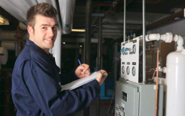 Hvac Tech Fixing Furnace